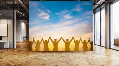 Silhouette of group happy business team making high hands over head in beautiful sunset sky evening time for business success and teamwork concept in company Wall mural