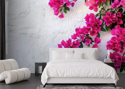 A vibrant pink bougainvillea flower adorns a wall with a summery Spanish flair a colorful blooming bougainvillea tree ideal tropical flora backdrop for the copy space image Wall mural