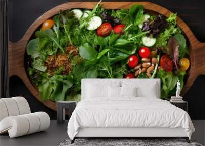 Close up wooden plate with mix of fresh leaf salad with copy space top view Healthy food Green meal Wall mural