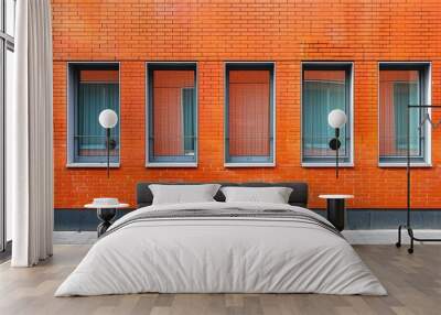 The facade consists of facing brick showcasing the textured surface of an orange brick wall with ample copy space image Wall mural