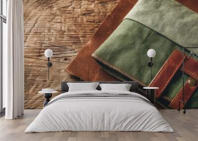 Top view of a green linen fabric wallet with brown real leather on a copy space image Wall mural