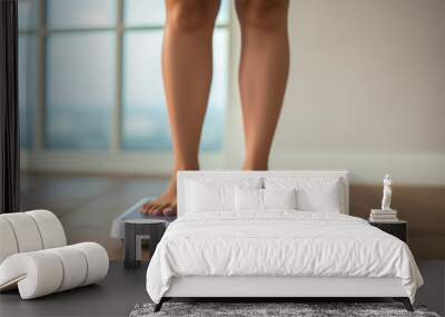 Closeup woman legs standing on an electronic weight scales Wall mural