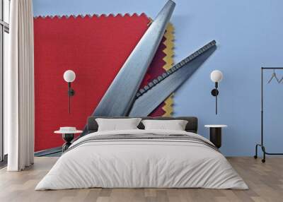 Zig Zag Scissors and examples of cloth pieces of red, dark red, gold on white background. Wall mural