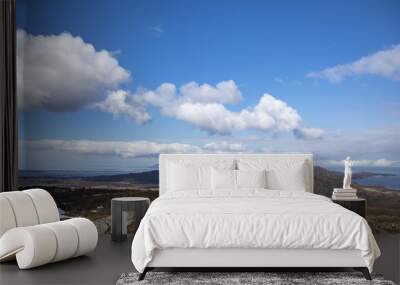 Blue skies and clouds in great spring  weather on Bronnoy mountain in Northern Norway Wall mural