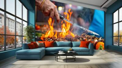 A chef grills meat and vegetable skewers over an open flame at an outdoor food market, creating a lively and engaging scene filled with smoke and the aroma of cooked food. Wall mural