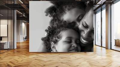 A heartwarming monochrome image showcasing a mother's tender embrace with her two young children, radiating love and care Wall mural