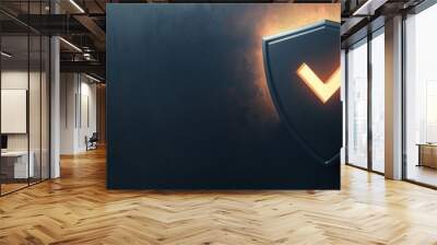 A high-tech black shield with a vivid orange chevron that symbolizes protection, security, and strength on a dark background Wall mural