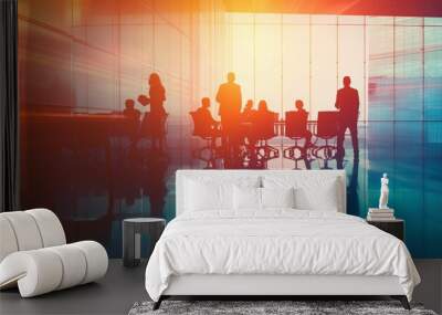 A vivid image capturing the dynamic atmosphere of a bustling office environment with silhouetted figures against a light-filled backdrop Wall mural