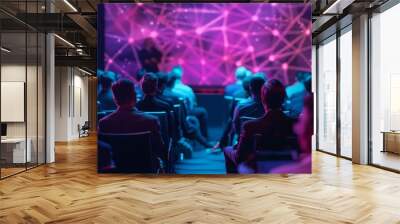 An auditorium filled with attentive spectators absorbed in a presentation at a futuristic conference event with striking pink and blue lights in the background Wall mural