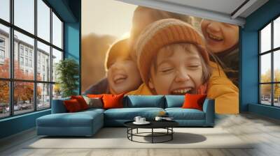 children in winter clothes sharing laughter in a sunny outdoor setting during winter Wall mural