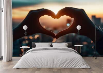 Cityscape Heart: A silhouette of hands forming a heart shape against a breathtaking cityscape backdrop, bathed in the warm glow of a setting sun. This image captures the essence of love, hope, and con Wall mural