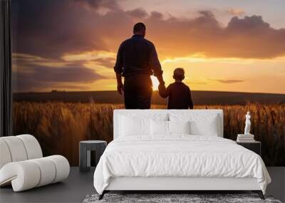 Golden Hour Legacy: A father and son, silhouetted against a breathtaking sunset, walk hand-in-hand through a golden wheat field, symbolizing the timeless bond of family and the promise of a new day.  Wall mural