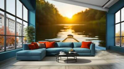 The image captures the front of a yellow kayak heading towards a beautiful sunset on a calm river, embodying serenity, adventure, and a connection with nature. Wall mural