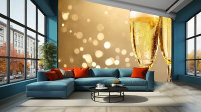 Two glasses of bubbling champagne against a glittery backdrop, evoking the spirit of a festive celebration Wall mural