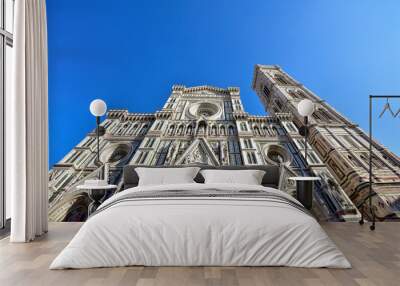 Giotto's Campanile and Cathedral of Santa Maria del Fiore in the Piazza del Duomo. Florence. Italy. Bottom up view.  Wall mural