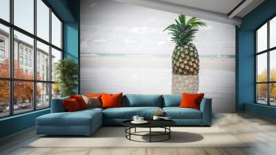 Exotic tropical fresh pineapple. Water reflection on the beach Wall mural