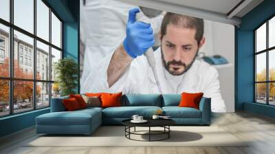 two scientists in the laboratory filling test tubes with pipette Wall mural