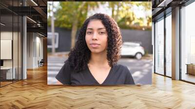 Black woman on urban background in casual clothing Wall mural