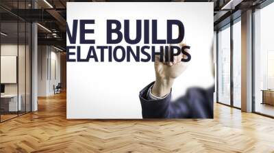 Business man pointing the text: We Build Relationship Wall mural