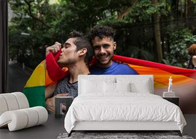 Gay Couple Taking a Selfie with Rainbow Flag in the Park Wall mural