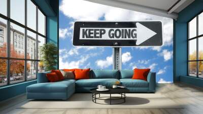 Keep Going direction sign with sky background Wall mural