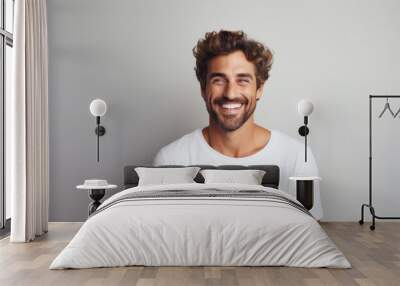 Beautiful caucasian man with smooth healthy face skin. Gorgeous man with a happy smile. Beauty and cosmetics skincare advertising concept. Wall mural