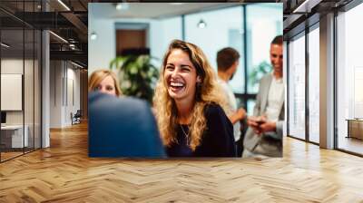 Happy colleagues having a holiday in an office. The concept of a party in a circle of colleagues Wall mural