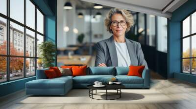 Portrait of a professional woman in a suit. Business woman standing in an office Wall mural