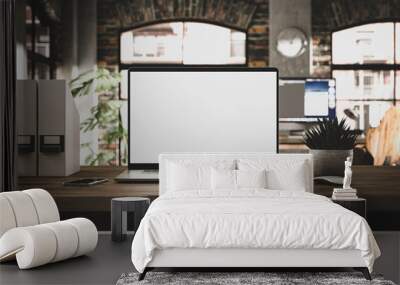 Laptop with blank screen mockup template on table in industrial old factory loft interior - front view	 Wall mural