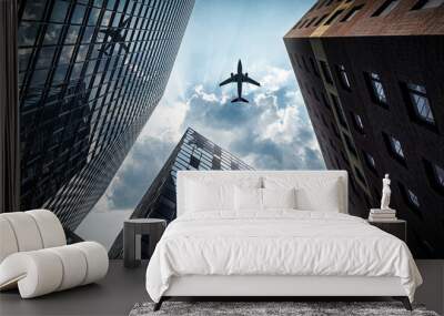 Office skyscrapers in the city with a cruise liner in the sky Wall mural