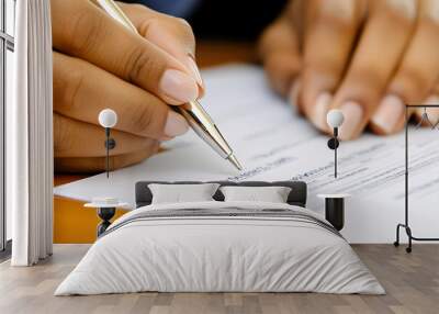 A person is writing with a pen on a piece of paper Wall mural