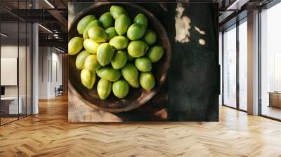 Green Mangoes in Wooden Bowl Wall mural