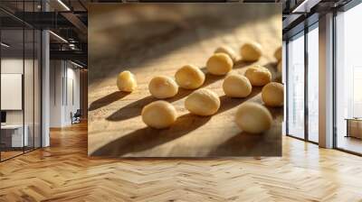 Macadamia Nuts Close Up on Wooden Table Wall mural