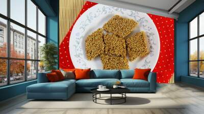 indian traditional homemade festival sweet til chikki made with sesame seed and gud or jaggery Wall mural