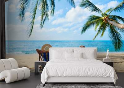 Couple relax on the beach enjoy beautiful sea on the tropical island Wall mural