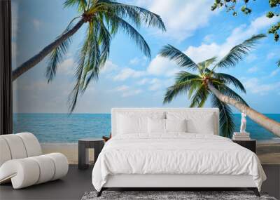 Couple relax on the beach enjoying beautiful sea on the tropical island Wall mural