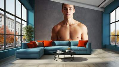 Portrait of muscular young man Wall mural