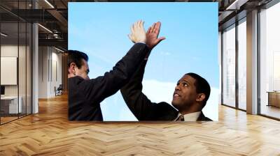 two businessman giving each other high five Wall mural