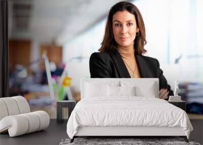 Confident businesswoman standing in a modern office and wearing business casual Wall mural