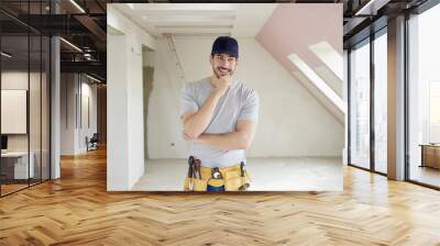 Professional young construction worker man portrait Wall mural