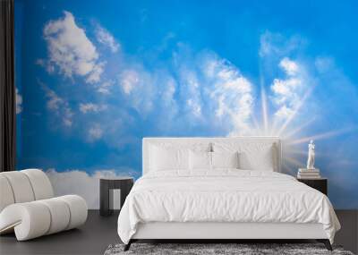 Beautiful, blue summer sky with fluffy clouds and bright sun as a background Wall mural