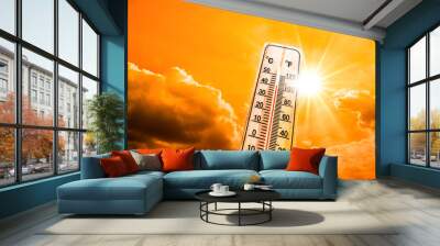 Hot summer or heat wave background, glowing sun on orange sky with thermometer Wall mural