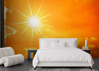 Hot summer or heat wave background, orange sky with clouds and glowing sun Wall mural