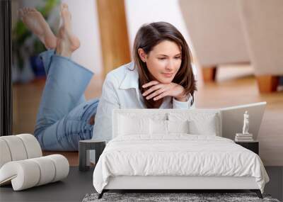 young woman with laptop and a cup of coffee on the floor Wall mural