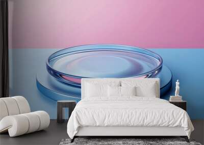 A clear glass petri dish is placed on a blue circular base, surrounded by soft pastel colors that create a serene and modern aesthetic Wall mural