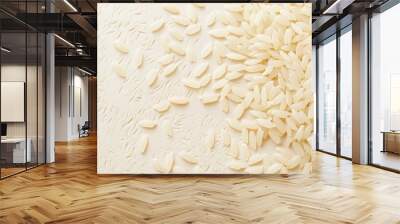 pile of raw white rice on a dark textured surface. Wall mural