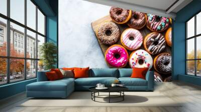 Overhead shot of doughnuts on a wooden board, doughnut day Wall mural