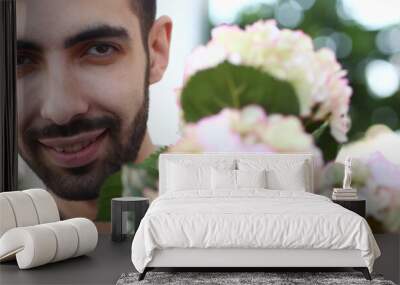 Bearded Male Florist with White Blooming Hydrangea Wall mural