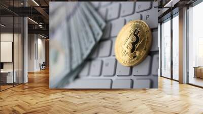 Coin crypto currency bitcoin lies on the keyboard background theme gold exchange pyramid for money due to rise or fall exchange rate closeup Wall mural