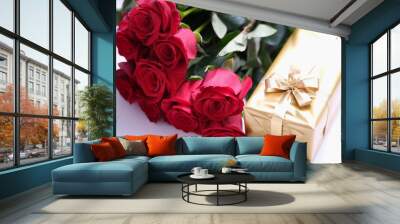 Gift golden box for valentine day with red roses. Beautiful bouquet of flowers and surprise box Wall mural